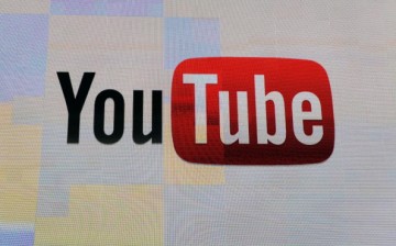 The YouTube logo appears on screen at the 2012 International Consumer Electronics Show at the Las Vegas Hotel & Casino on January 12, 2012.
