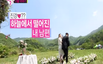 Jota and Kim Jin Kyung walk down the flower laden walkway as they 'got married.'