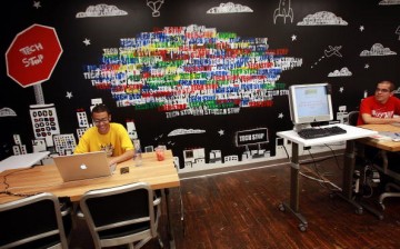 Employees of Google work at a 'tech stop' at the internet company's new office space