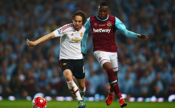 West Ham United striker Diafra Sakho (R) competes for the ball against Manchester United's Daley Blind.