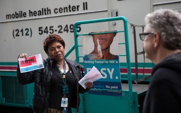 An HIV Prevention Specialist solicits people on the street to take a free HIV test.