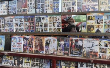 Pirated DVD copies of movies are displayed in a market at Xinjiang Uyghur Autonomous Region.