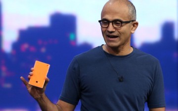 Microsoft CEO Satya Nadella holds a new Nokia Lumia 930 as he delivers a keynote address during the 2014 Microsoft Build developer conference on April 2, 2014 in San Francisco, California. 