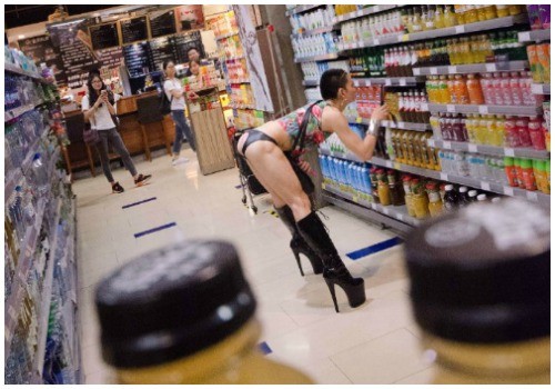 Photos of drag queen who was scantily dressed while shopping in a Shenzhen supermarket became viral on Weibo.
