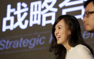 Jean Liu, Didi Chuxing president, answers questions from media during a news conference in Beijing early this year.  