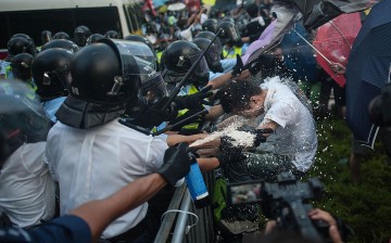 Pro-democracy protesters clash with riot police on Sept. 27, 2014 in Hong Kong. 