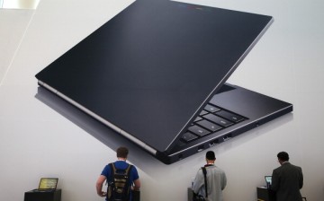 Attendees inspect the Google Chromebook Pixel laptop during the Google I/O developers conference