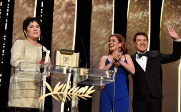 Jaclyn Jose reacts on stage as Andi Eigenmann and director Brillante Mendoza applaud after being awarded the Best Actress prize during the closing ceremony of the annual 69th Cannes Film Festival. 