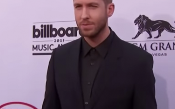 Calvin Harris poses for the camera during the 2015 Billboard music awards.   