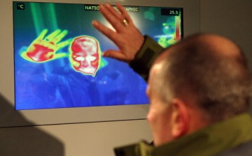 Colin Dealey stands in front of a thermal imaging camera in a giant fridge, which simulates arctic conditions, to test the insulation of his coat in the National Geographic store on Regent Street.
