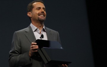 Andrew House, President and Group CEO Sony Computer Entertainment Inc., holds up a Playstation 4 at the Sony Playstation E3 2013 press conference June 10, 2013 in Los Angeles, California.