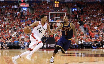 Toronto Raptors' DeMar DeRozan drives against Cleveland Cavaliers' J.R. Smith in the third quarter in Game 6 of the Eastern Conference Finals during the 2016 NBA Playoffs at Air Canada Centre. 