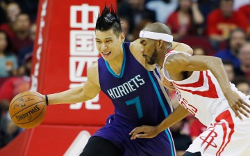 Jeremy Lin drives with the ball against Corey Brewer of the Houston Rockets during their game at Toyota Center last Dec. 21, 2015.