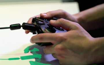 Am Xbox One controller is used at the Microsoft Xbox booth during the Electronics Expo 2013 at the Los Angeles Convention Center on June 11, 2013 in Los Angeles, California. 