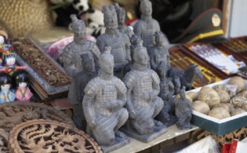 Some miniature sculptures of the famous Terracotta warriors get sold in a market in China along with other interesting souvenir items.