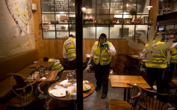 Following the Tel Aviv shooting, members of an Israeli ZAKA - Identification, Extraction and Rescue team work at the scene of a shooting outside Max Brenner restaurant in Sarona Market on June 8, 2016 in Tel Aviv, Israel. 