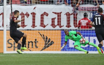 USA striker Clint Dempsey (L) scores the team's opening goal against Costa Rica's Patrick Pemberton.