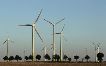 Wind turbines spin to produce electricity on Aug. 20, 2010, in Roedgen near Bitterfeld, Germany.