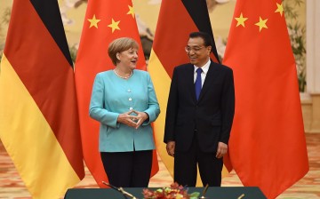 Chinese Premier Li Keqiang holds a joint press conference with German Chancellor Angela Merkel in Beijing.