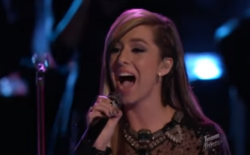Christina Grimmie sings “Can’t Help Falling in Love” on stage of “The Voice.” 