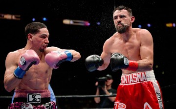 Robert Guerrero (R) reacts after getting hit on the head by Danny Garcia during the WBC championship welterweight bout at Staples Center January 23, 2016 in Los Angeles, California.