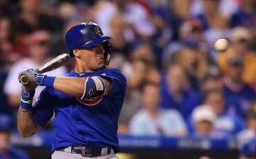 Javier Baez of the Chicago Cubs ducks away from a high pitch in the eighth inning against the Philadelphia Phillies.