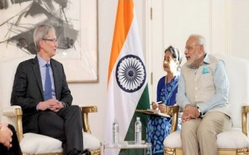 Apple CEO Tim Cook speaks with Prime Minister Narendra Modi during his visit to India earlier this year.