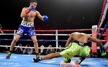 Gennady Golovkin of Kazakhstan knocks down Dominc Wade for the second time on way to a second round TKO during his unified middleweight title fight at The Forum on April 23, 2016 in Inglewood, California.