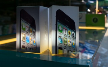 Fake iPhone packaging is displayed on a stall at an outdoor market selling counterfeit Chinese made items in the Golden Triangle, situated along the Thai- Burma border on Nov. 12, 2012 in Tachiliek, Myanmar. 