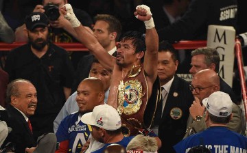 Manny Pacquiao celebrates after defeating Timothy Bradley Jr. in their welterweight fight on April 9, 2016 at MGM Grand Garden Arena in Las Vegas, Nevada.