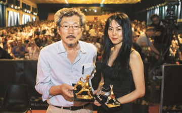 Film director Hong Sang Soo and actress Kim Jee Woon at the at the 68th Locarno International Film Festival.