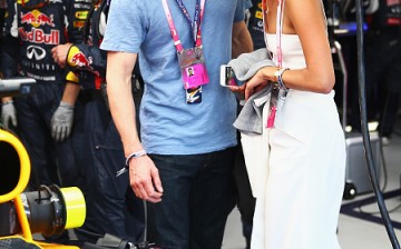 Actors Alicia Vikander and Michael Fassbender are seen in the Infiniti Red Bull Racing team garage before the Monaco Formula One Grand Prix at Circuit de Monaco on May 24, 2015 in Monte-Carlo, Monaco.