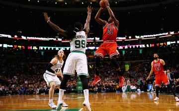 Chicago Bulls shooting guard Jimmy Butler (#21) shoots over Boston Celtics' Jae Crowder (#99).