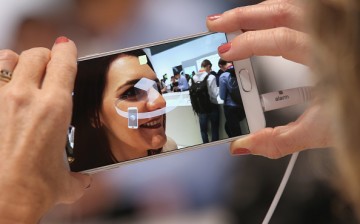 A visitor tries out the camera on a Galaxy Note 5 smartphone at the Samsung stand during a press day at the 2015 IFA consumer electronics and appliances trade fair on Sept. 3, 2015 in Berlin, Germany. 