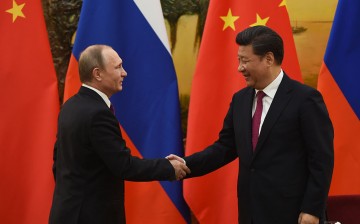 Chinese President Xi Jinping and Russian President Vladimir Putin make a joint statement during the latter's state visit in Beijing.