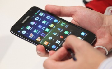 A visitor is checking out the Samsung Galaxy Note mini tablet at the IFA 2011. 