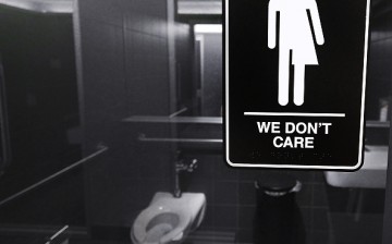 Gender neutral signs are posted in the 21C Museum Hotel public restrooms on May 10, 2016 in Durham, North Carolina. 