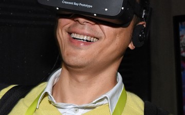 A man tests a virtual reality goggle at the 2015 International CES.