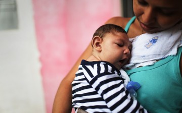Mother Daniele Santos holds her baby Juan Pedro, who has microcephaly, on May 30, 2016 in Recife, Brazil. 