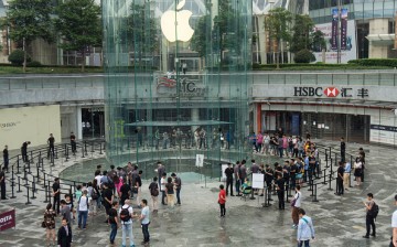 Customers line up to enter an Apple store on Sept. 25, 2015, in Shanghai, China. 
