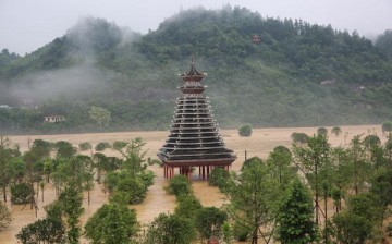 A drum tower is flooded at a riverside park in Rongjiang county, Southwest China's Guizhou Province, on July 2, 2016, after heavy rain caused the water level in the river to rise. 