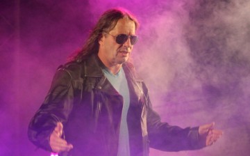 Bret Hart poses during his entrance at a WWE Live Event in Durban, South Africa.