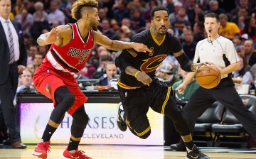 Allen Crabbe #23 of the Portland Trail Blazers guards J.R. Smith #5 of the Cleveland Cavaliers during the second half at Quicken Loans Arena on December 8, 2015 in Cleveland, Ohio