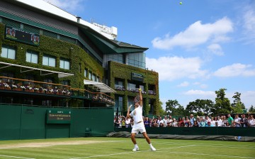 Roger Federer of Switzerland serves during practice on day ten of the Wimbledon Lawn Tennis Championships at the All England Lawn Tennis 