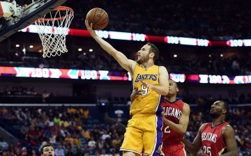 Los Angeles Lakers point guard Marcelo Huertas drives for a layup against the New Orleans Pelicans.