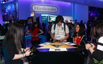 Game enthusiasts test new game titles at the Nintendo exhibit during the Annual Gaming Industry Conference E3 at the Los Angeles Convention Center on June 16, 2015 in Los Angeles, California.