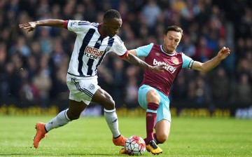 West Brom striker Saido Berahino competes for the ball against West Ham's Mark Noble.