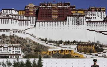 A paramilitary policeman stands guard in front of the Potala Palace in Lhasa.