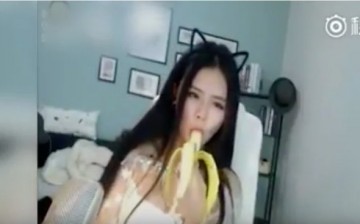 Screengrab from a controversial Chinese live streaming footage showing a woman eating a banana 