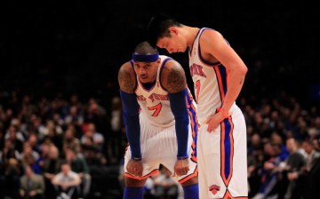 Carmelo Anthony and Jeremy Lin stand on the court against the New Jersey Nets at Madison Square Garden on February 20, 2012.